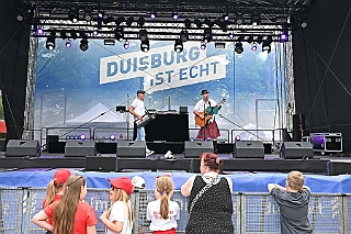 HDKSommerBiwak 2024-07-21 02  HDK Sommerbiwak 2024 - Pünktlich um 11.11 Uhr startete das 7. Sommerbiwak vom Hauptausschuss auf der Hauptbühne beim Duisburger Stadtfest zwischen City Palais und Forum. Die Akteure   im unterhaltsamen Programm, die Stark Reduzierte Einzelstücke, ⁠Lonnie & Friends von den Jungpiraten, die designierte Kinderprinzencrew 2024/25, ⁠Annika (Solo-Mariechen der KG Marxloher Jecken), die Kölner Band „⁠Miljö“ , wir die designierte Prinzencrew 2024/25 mit Holger II. und ⁠Philipp Godart. Für musikalische Untermalung sorgte das DJ Duo Schwarzwaldzimmer. : DVPJ, Holger II, Phil II., Prinz Karneval, Prinz, Prinzessin Mia I., Hofmarschälle, Page, Pagen, Paginnen, HDK, Duisburg, Karneval, Helau, Tollität, Event, Session 2024, Session 2025, HDK Duisburg, Hauptausschuss, Hauptausschuss Karneval Duisburg, Duisburg ist echt